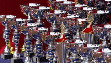 Several banked rows of silver trophies